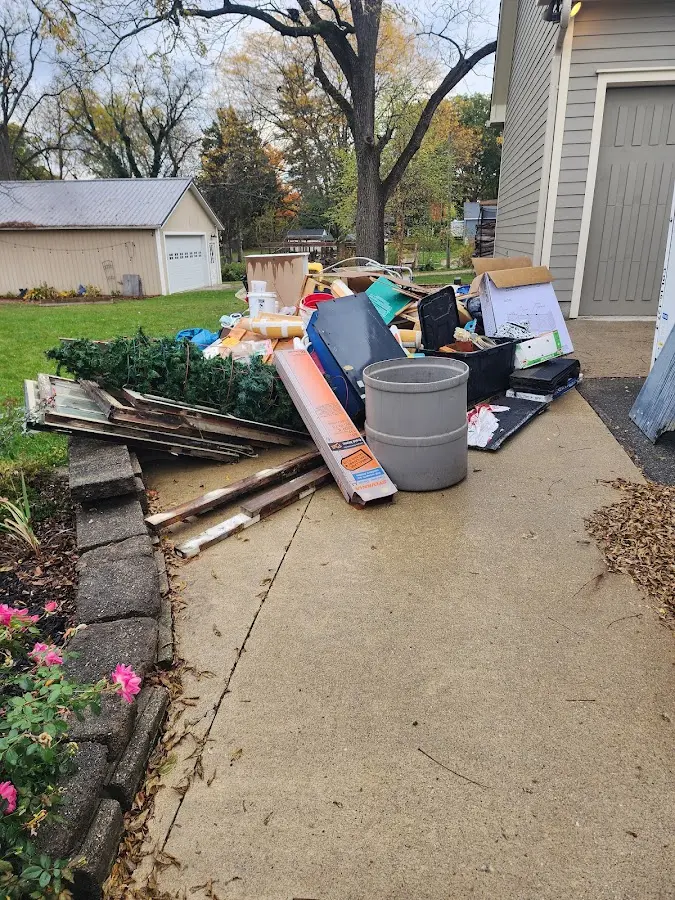 Dumpster being loaded with debris for Roofing Dumpster Rental in New Freedom